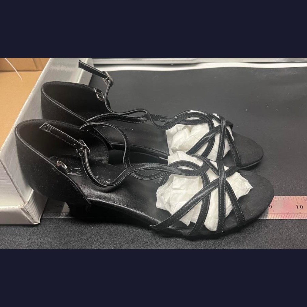 Black dance shoes, size 5, side view against a ruler showing shoe length